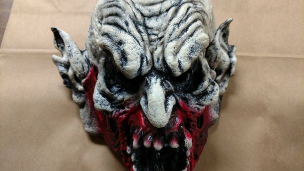 Scary clown mask with blood from the attacker on it. // Image: Holly Hills Police Department
