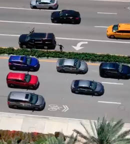 suspect seen in traffic with arms out
